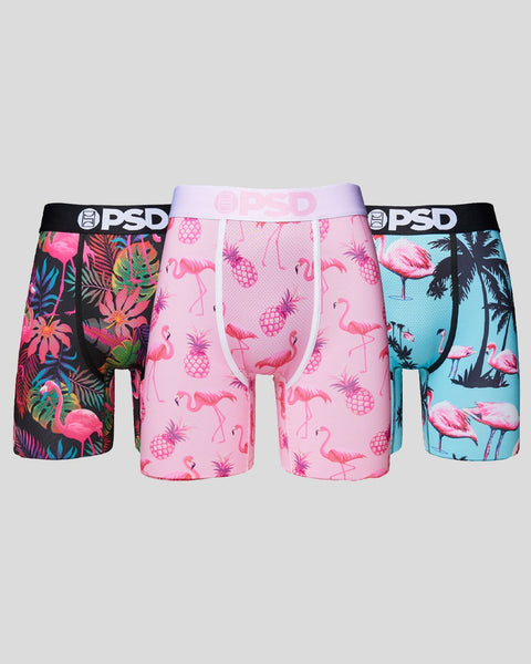 Three PSD brand boxer briefs with flamingo and pineapple prints on black, pink, and blue backgrounds.