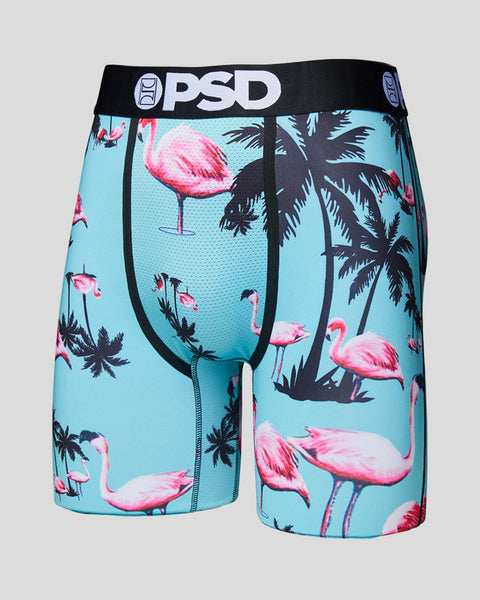 PSD boxer briefs with blue background featuring pink flamingos and black palm tree designs.