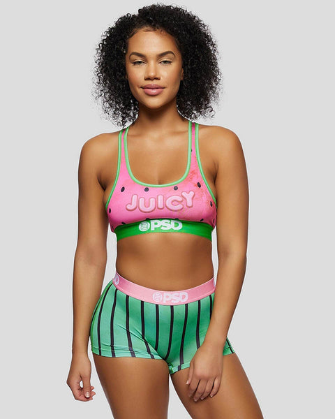 Pink sports bra with green trim and 