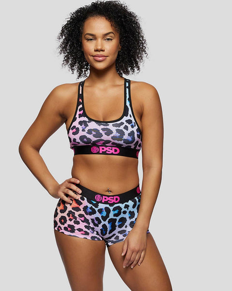 Multicolored leopard print sports bra and boy shorts set with black PSD branding on elastic bands.
