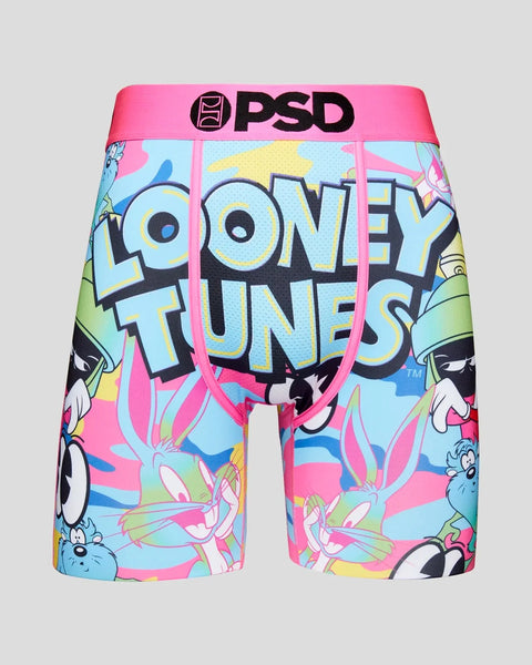 PSD brand boxer shorts with Looney Tunes characters and "Looney Tunes" text on colorful pink and blue background.