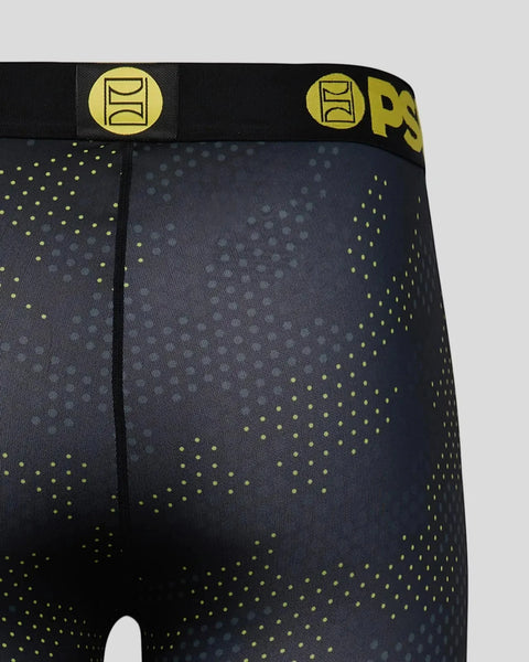 Dark navy 3/4 length athletic tights with neon yellow dot pattern and branded waistband with logo.