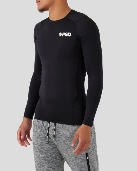 Black long sleeve compression shirt with white PSD logo on chest, fitted design.