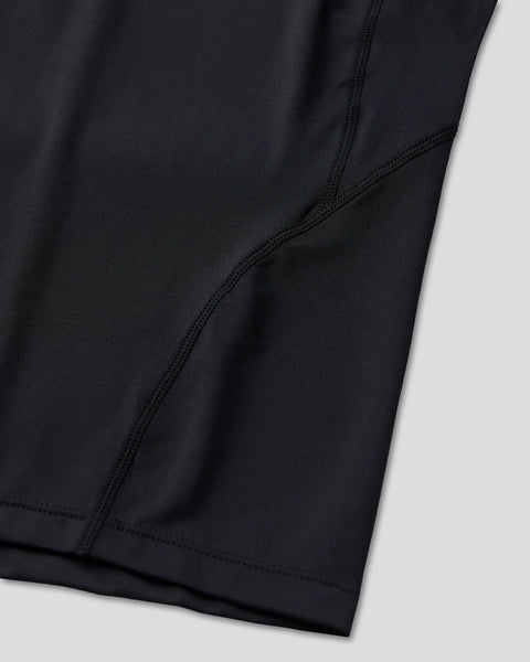 Black long-sleeve compression tee with fitted seams and hemmed edges.