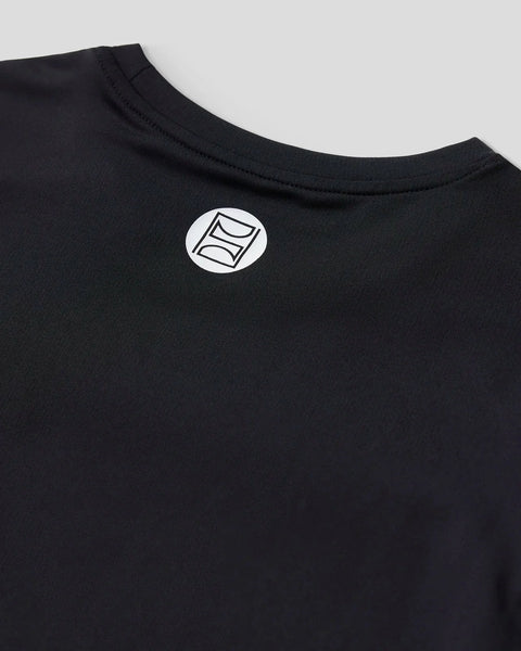 Black long-sleeve compression tee with white geometric logo on back neckline.