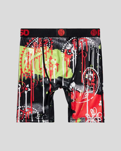 Black boxer briefs with red, white, and neon yellow paisley and drip pattern design, red waistband with logo.