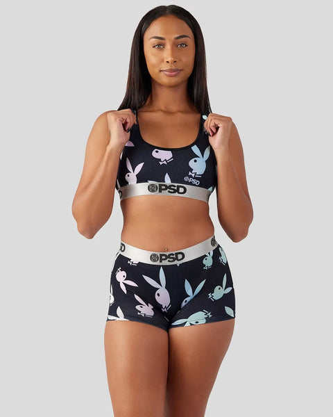 Black sports bra and shorts set with multicolored bunny print and white PSD waistbands.