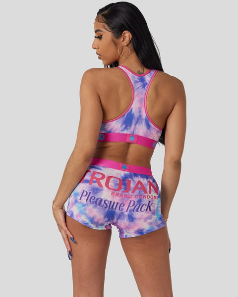 Woman wearing a pink and blue tie-dye sports bra and matching shorts with 