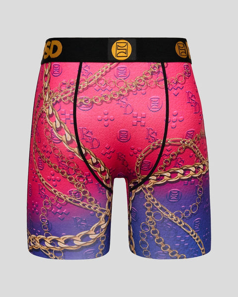 Men's boxer briefs with pink-to-purple ombre gradient, gold chain pattern, repeating logo symbols, and black waistband with g