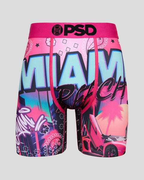 PSD boxer briefs with bright pink and blue Miami Beach graphic print, palm trees, sports car, and decorative elements.