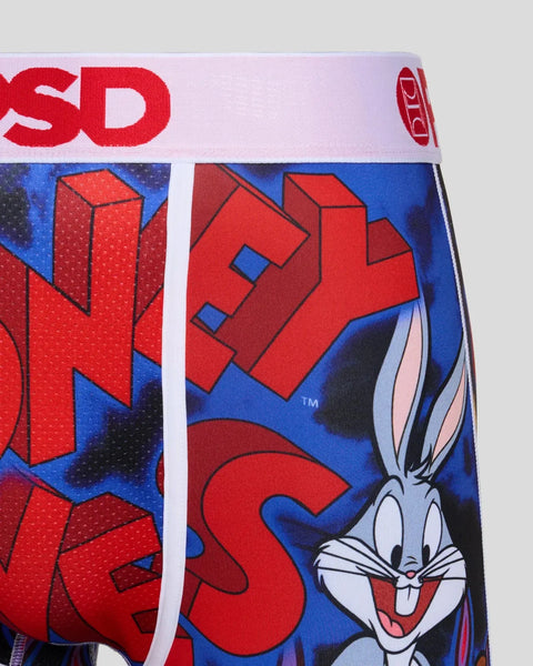 Looney Tunes character print fabric with red and blue geometric shapes and cartoon rabbit graphic.