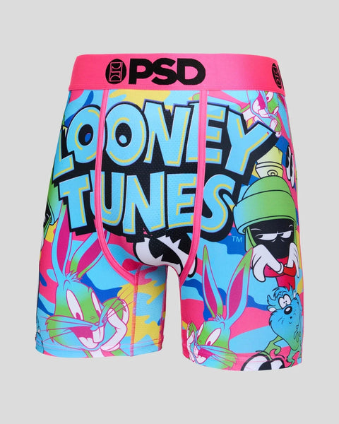PSD boxer shorts with pink waistband and colorful Looney Tunes characters and text printed on blue, pink and yellow fabric.
