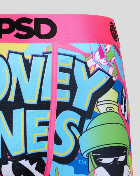 PSD Looney Tunes underwear with pink waistband and colorful cartoon character graphics on light blue background.