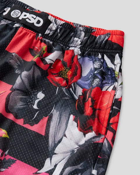 Black athletic short with red and purple floral print, red waistband trim, and PSD brand label visible at waistband.