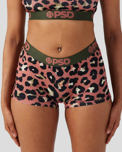 PSD underwear set with coral leopard print, black spots, and olive green waistband with logo.