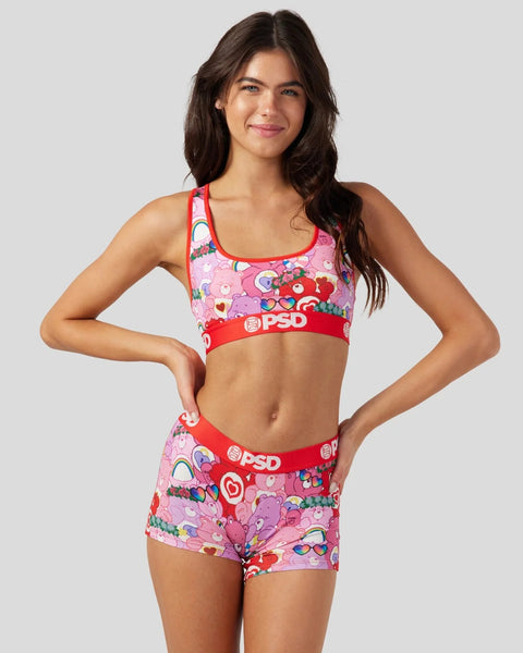 Pink Care Bears sports bra and shorts set with red trim and PSD branding.
