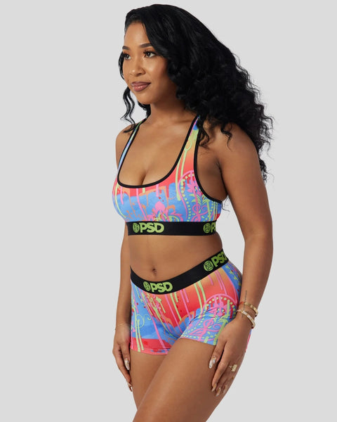 Colorful paisley print sports bra and shorts set with black PSD waistbands and trim.
