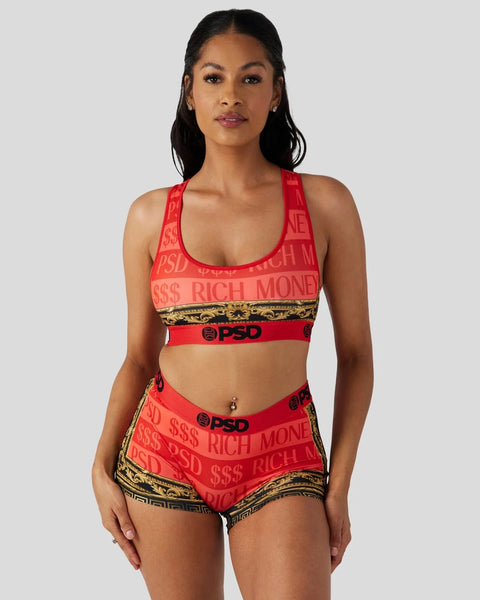Woman wearing red sports bra and shorts set with 