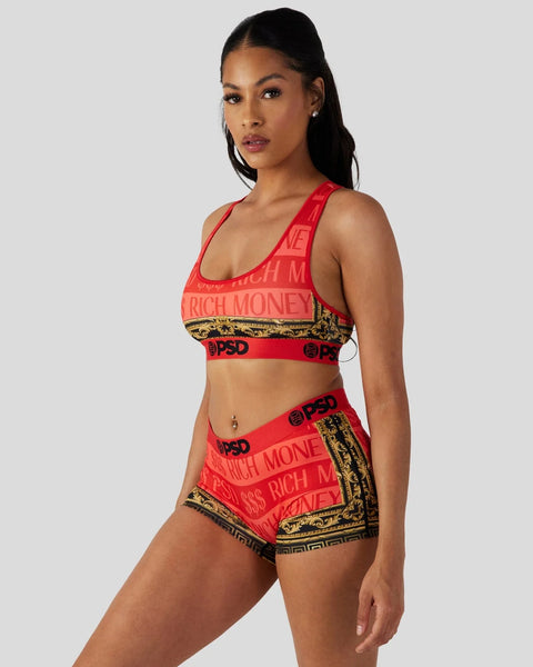 Woman wearing red sports bra and shorts with 