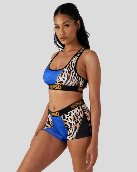 Two-piece sports set with blue and tiger-stripe pattern panels, black elastic waistband with gold branding.