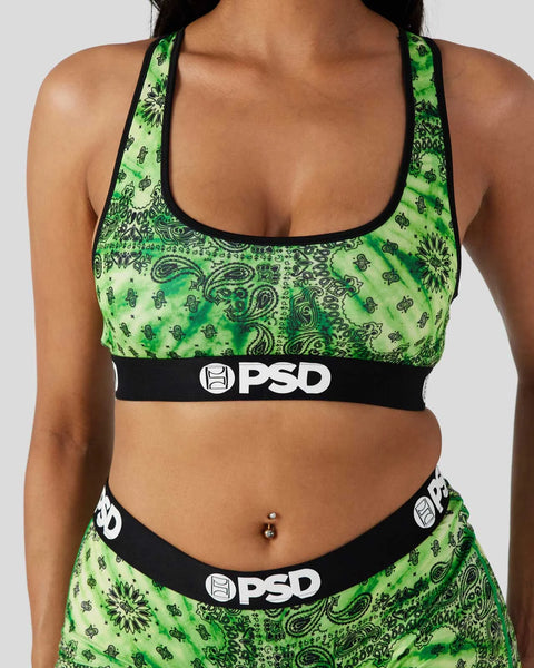 Lime green bandana print sports bra with black trim and PSD branding on elastic waistband.
