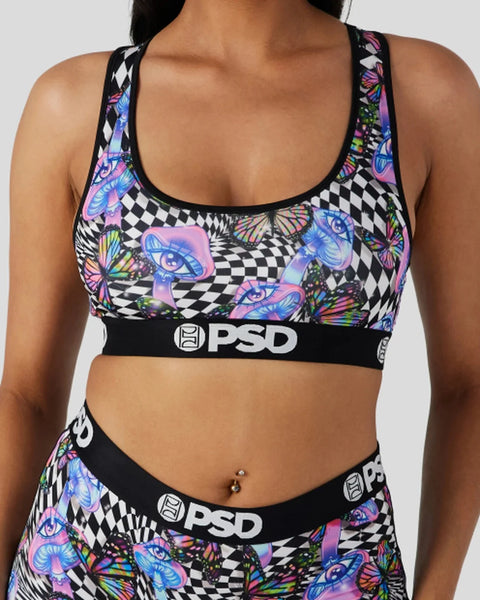 Racerback sports bra with black and white checkered pattern, colorful butterfly and eye motifs, and PSD waistband.