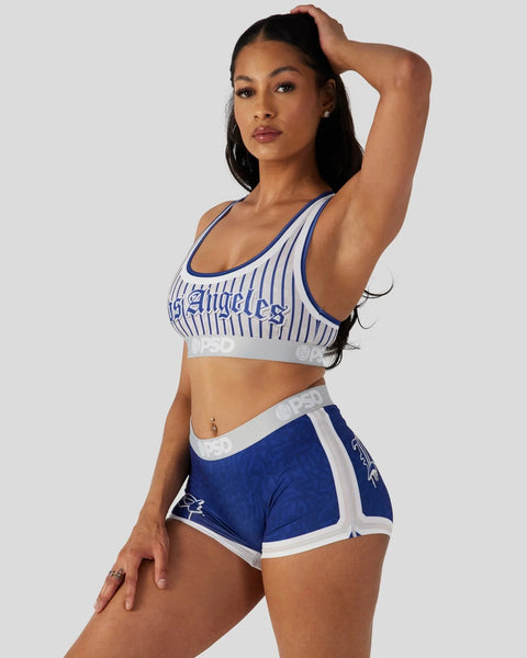 Woman wearing white and blue pinstriped sports bra with 