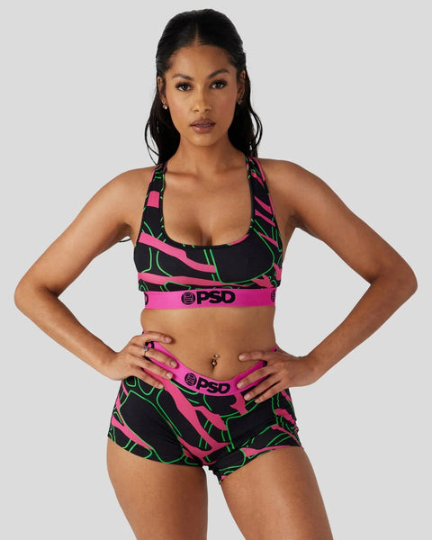 Neon giraffe patterned sports bra and shorts set in black, pink, and green with PSD branding.