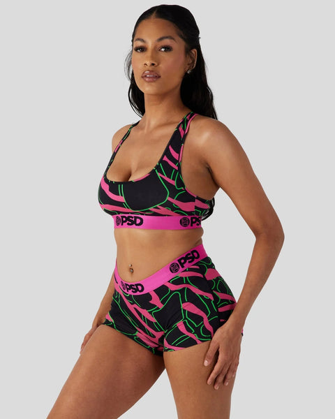 Black sports bra and shorts set with neon pink and green giraffe stripe pattern and pink waistband.
