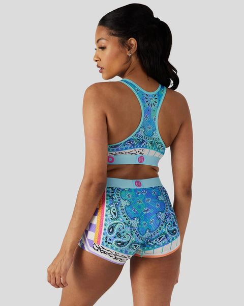 Turquoise racerback sports bra and matching shorts with blue paisley and geometric patterns.