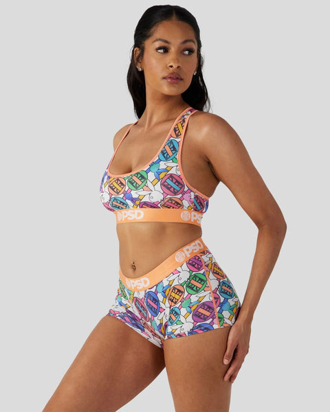 Playboy Geo sports bra and shorts set with colorful geometric pattern and orange branded waistband.