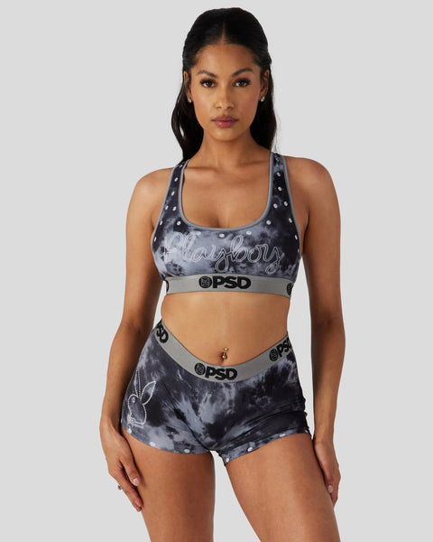 Black and gray tie-dye sports bra and shorts set with Playboy branding and PSD waistband.
