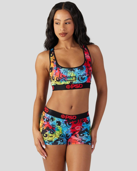 Powerpuff Girls sports bra and shorts set in multicolor cartoon print with black PSD branding.