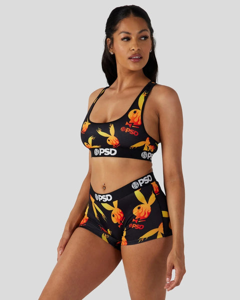 Black sports bra and shorts set with yellow and orange flame pattern and PSD branding.