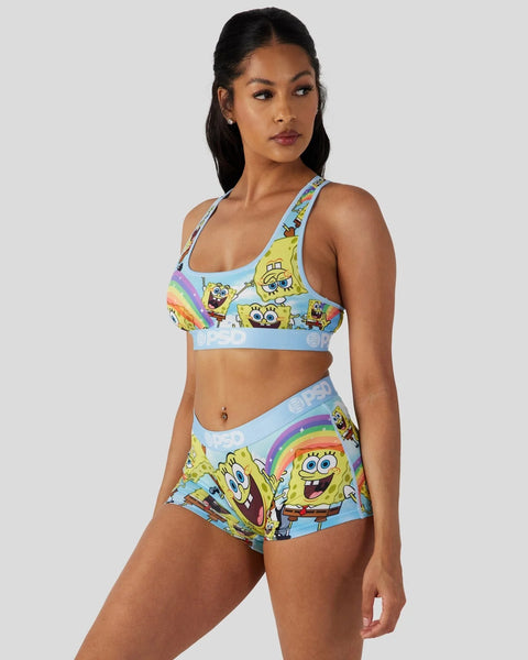 SpongeBob SquarePants sports bra and shorts set with character graphics and rainbow details on light blue background.