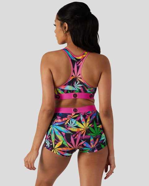 Multicolored neon leaf-print sports bra and shorts set with pink trim and logo details, shown from back view.