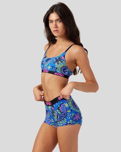 Blue bandana-print sports bra and shorts set with neon pink and yellow accents and black elastic bands.