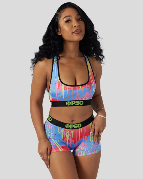 Colorful paisley-print sports bra and shorts set with black PSD waistband trim.