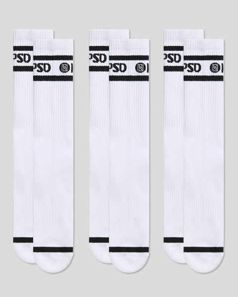 Three white crew socks with black logo stripes and text across the calf.