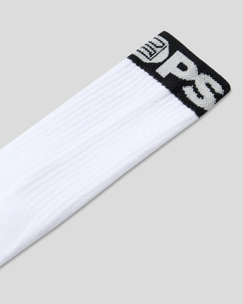 White crew socks with black and white band logo stripe at cuff.