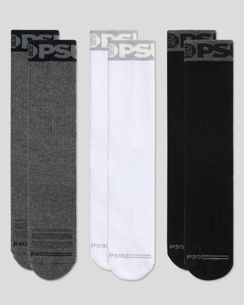 Three pairs of crew socks in grey, white, and black with branded ribbed cuffs and heel reinforcement.
