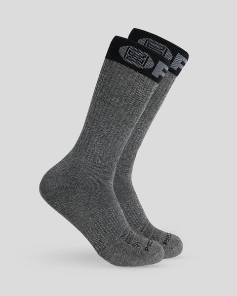 Two grey crew socks with black band at cuff and heel reinforcement visible.