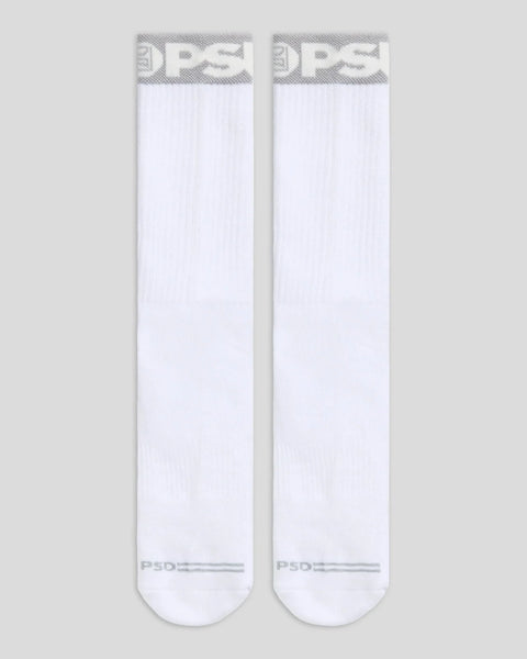 Two white crew socks with grey branding at cuff and toe.