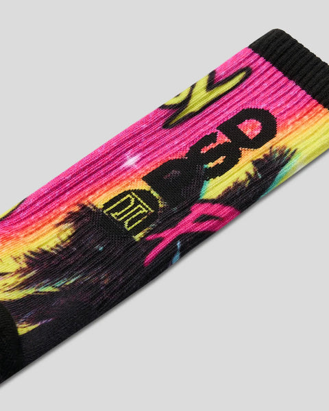 Ribbed sock with neon pink, yellow, and black colorblock design featuring Playboy bunny logo and silhouette graphic.