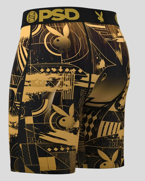 Black and gold boxer shorts with Playboy bunny logo and art deco geometric patterns throughout.