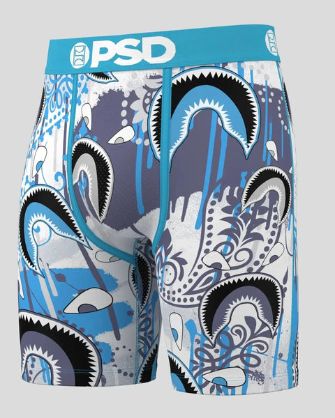 PSD bandana-print boxer briefs with blue, white, and black abstract eye design and turquoise waistband.