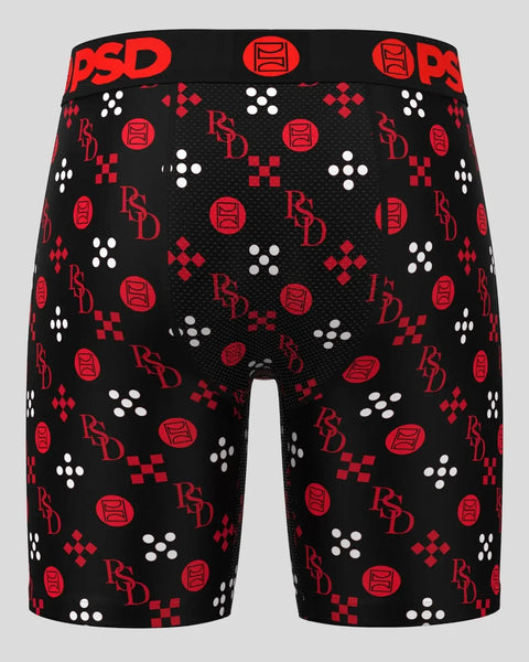 Black boxer briefs with red and white geometric patterns, PSD branding, and logo throughout.