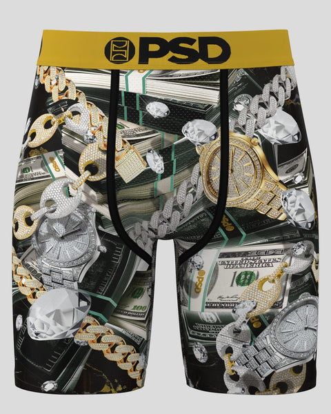 PSD boxer briefs with all-over print of diamonds, gold chains, watches, and cash on black background.