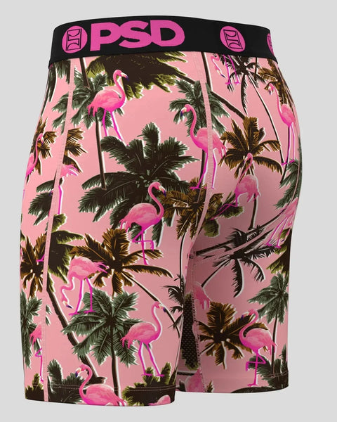Pink shorts with flamingo and palm tree pattern, black PSD waistband with logo.