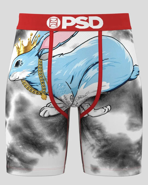 PSD boxer briefs with blue crowned rabbit graphic, gold chain detail, and red waistband on gray cloudy background.